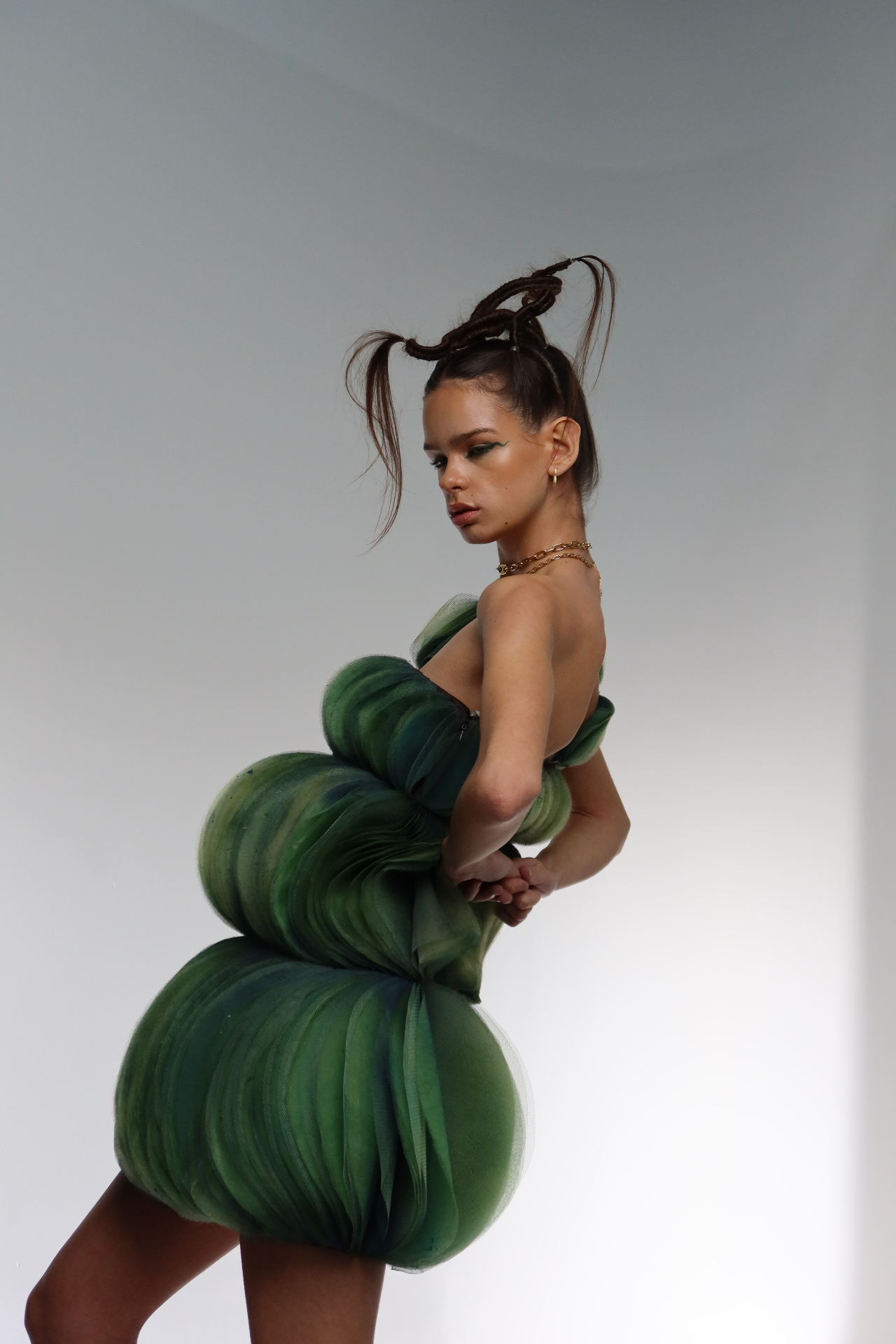 Editorial portrait in sculptural green tulle dress