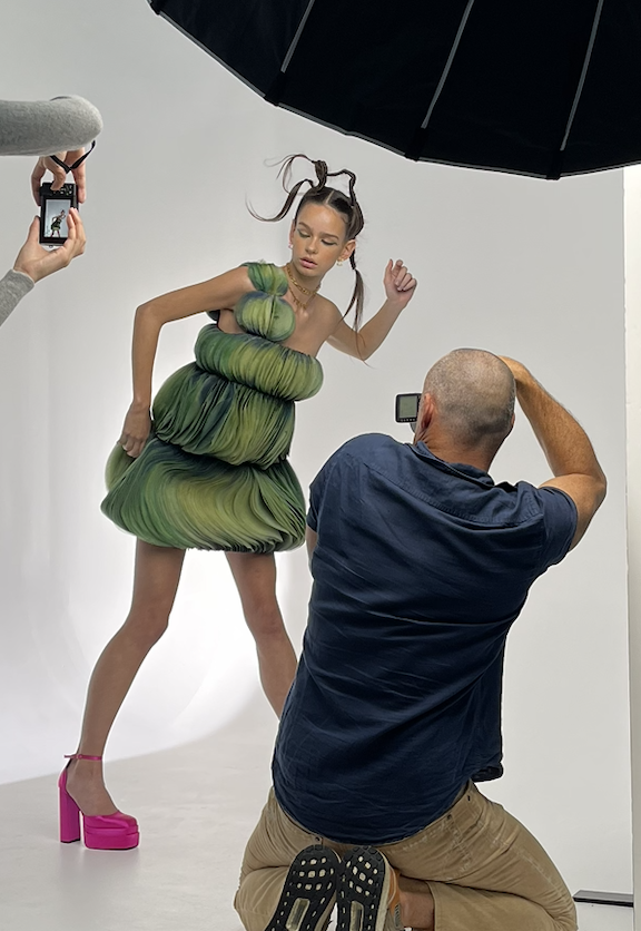 Photographer shooting the green tulle look on set