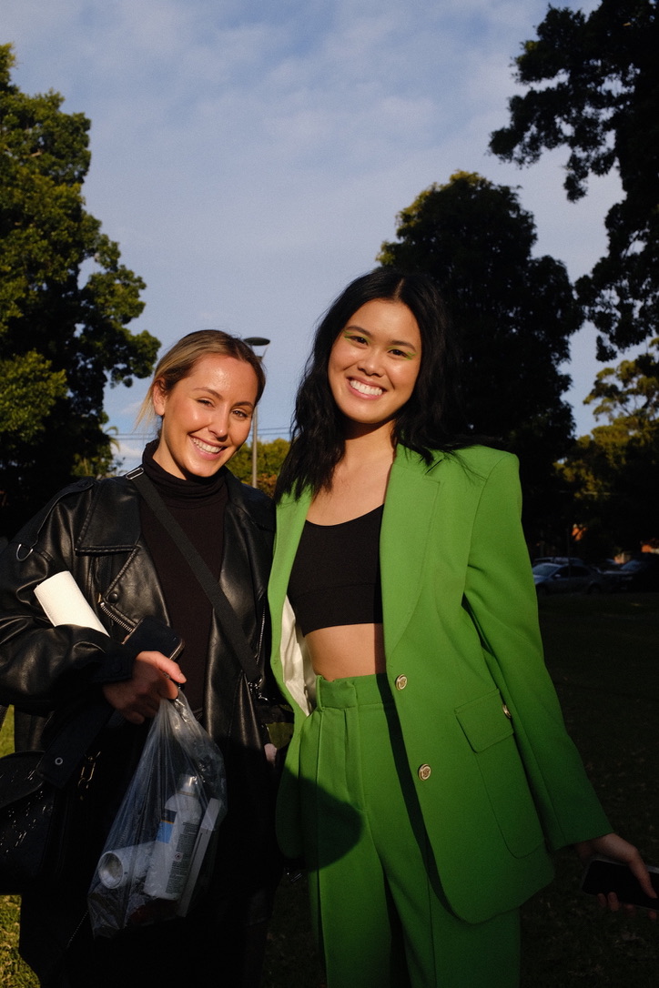 Outdoor portrait in a green suit between shoot moments
